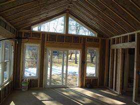 Trapezoid window added above door: 
